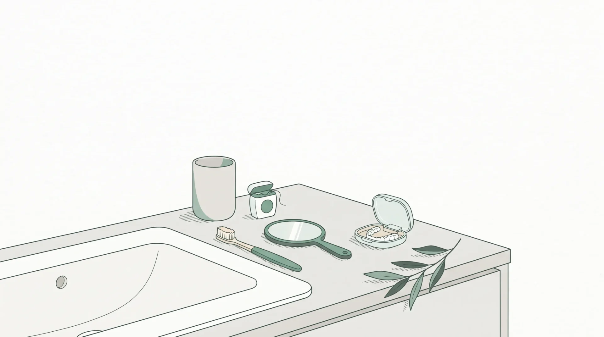 A tidy bathroom vanity shows a toothbrush, floss and clear aligner case in everyday cosmetic care.